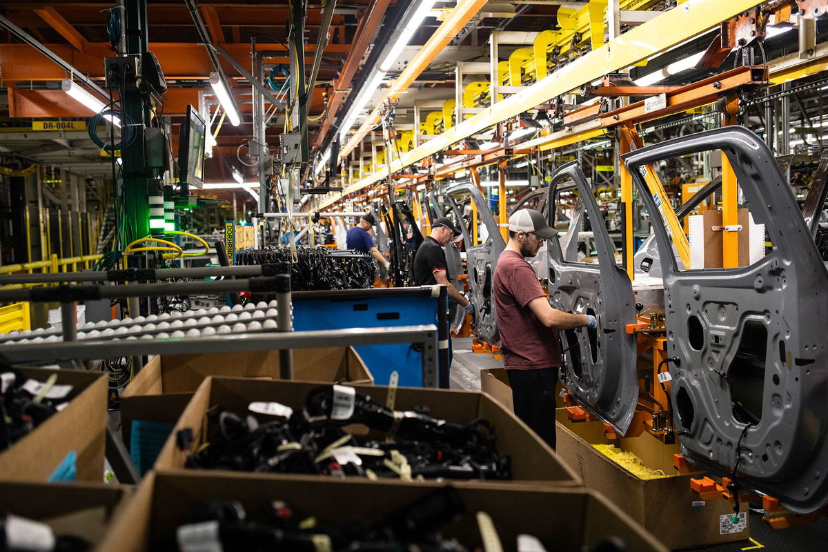 <i>Emily Elconin/Bloomberg/Getty Images via CNN Newsource</i><br/>Workers assemble vehicle doors at the General Motors assembly plant in Fort Wayne