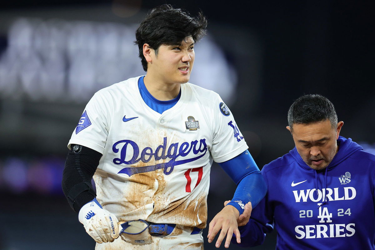 <i>Kevork Djansezian/Getty Images via CNN Newsource</i><br />Shohei Ohtani of the Los Angeles Dodgers lies on the ground injured after attempting to steal second base in the seventh inning during Game 2 of the 2024 World Series at Dodger Stadium on Saturday in Los Angeles