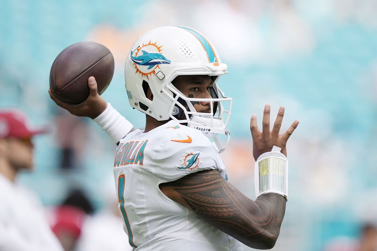 <i>Rebecca Blackwell/AP via CNN Newsource</i><br/>Miami Dolphins quarterback Tua Tagovailoa warming up before game against the Arizona Cardinals.