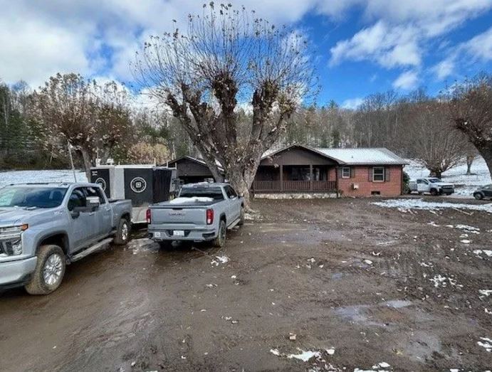 <i>WLOS via CNN Newsource</i><br/>Aaron and Stephanie Buchanan's home in Bakersville is a total loss with a contractor estimating repairs at $200