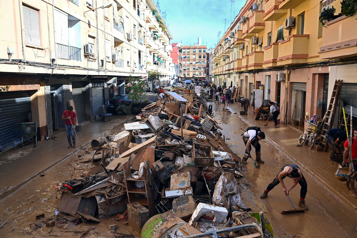 <i>Jose Jordan/AFP via Getty Images via CNN Newsource</i><br/>Debris piled up along a street on November 1