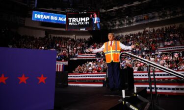 Trump supporters wait for the former president to speak at the Green Bay campaign rally on Wednesday