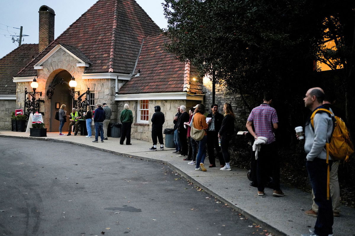 <i>Cheney Orr/Reuters via CNN Newsource</i><br/>People line up to vote in the 2024 U.S. presidential election on Election Day at Park Tavern in Atlanta