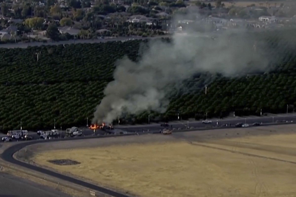 <i>KNXV-TV/ABC 15 Arizona/AP via CNN Newsource</i><br/>An image taken from aerial video shows smoke rising from a deadly plane crash Tuesday