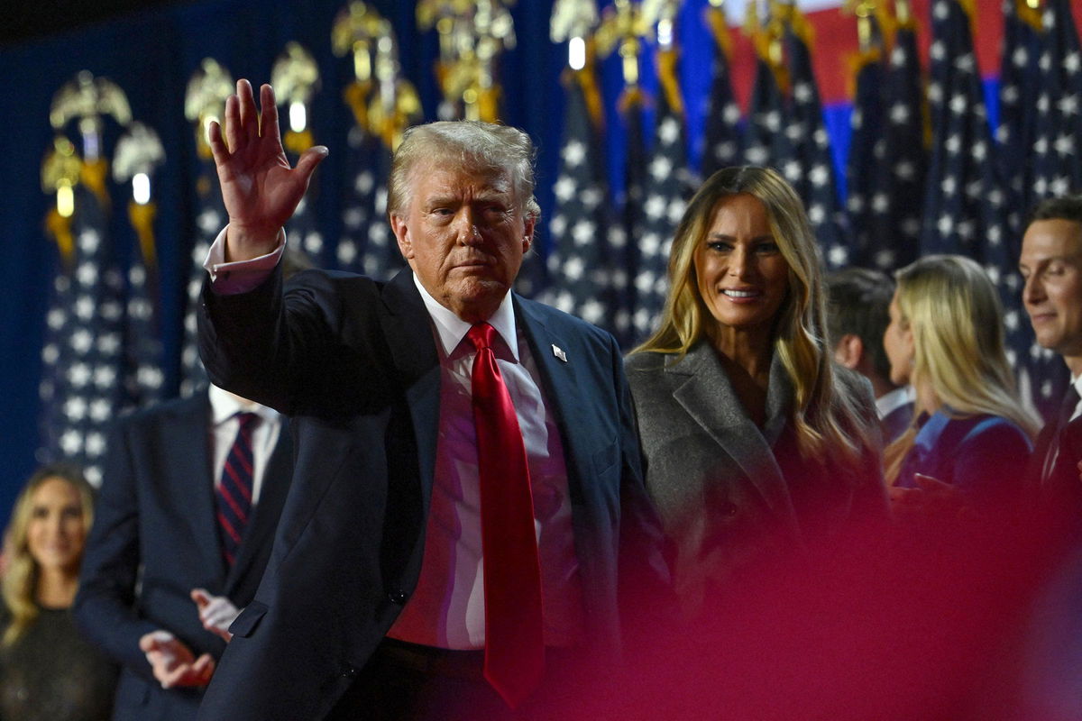 <i>Callaghan O'Hare/Reuters via CNN Newsource</i><br/>President-elect Donald Trump waves while walking off stage following early results from the 2024 presidential election in Palm Beach County Convention Center