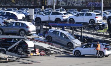 Vehicles are loaded onto car carriers at the Volkswagen plant in Zwickau