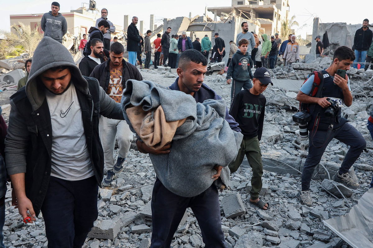 <i>Abd Elhkeem Khaled/Reuters via CNN Newsource</i><br/>A man carries the body of a Palestinian killed by an Israeli airstrike on a house