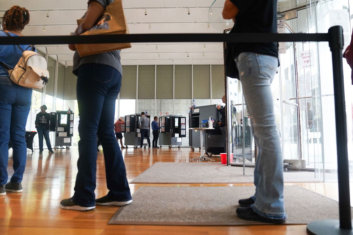 <i>Megan Varner/Getty Images via CNN Newsource</i><br/>Voters head into a polling location to cast their ballots on the last day of early voting for the 2024 election on November 1