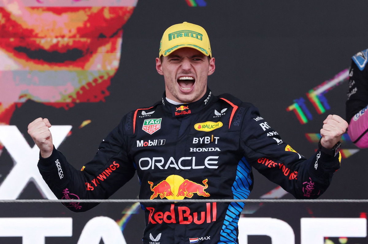 <i>Clive Mason/Getty Images via CNN Newsource</i><br/>Rain kicks up off the back of Verstappen's car as he competes during the Sao Paulo Grand Prix.