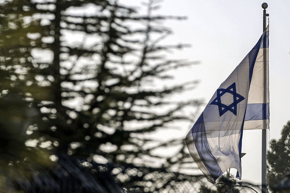 <i>Nathan Howard/Pool/AFP/Getty Images/File via CNN Newsource</i><br/>An Israeli flag flies outside the Prime Minister's Office in Jerusalem on October 22.