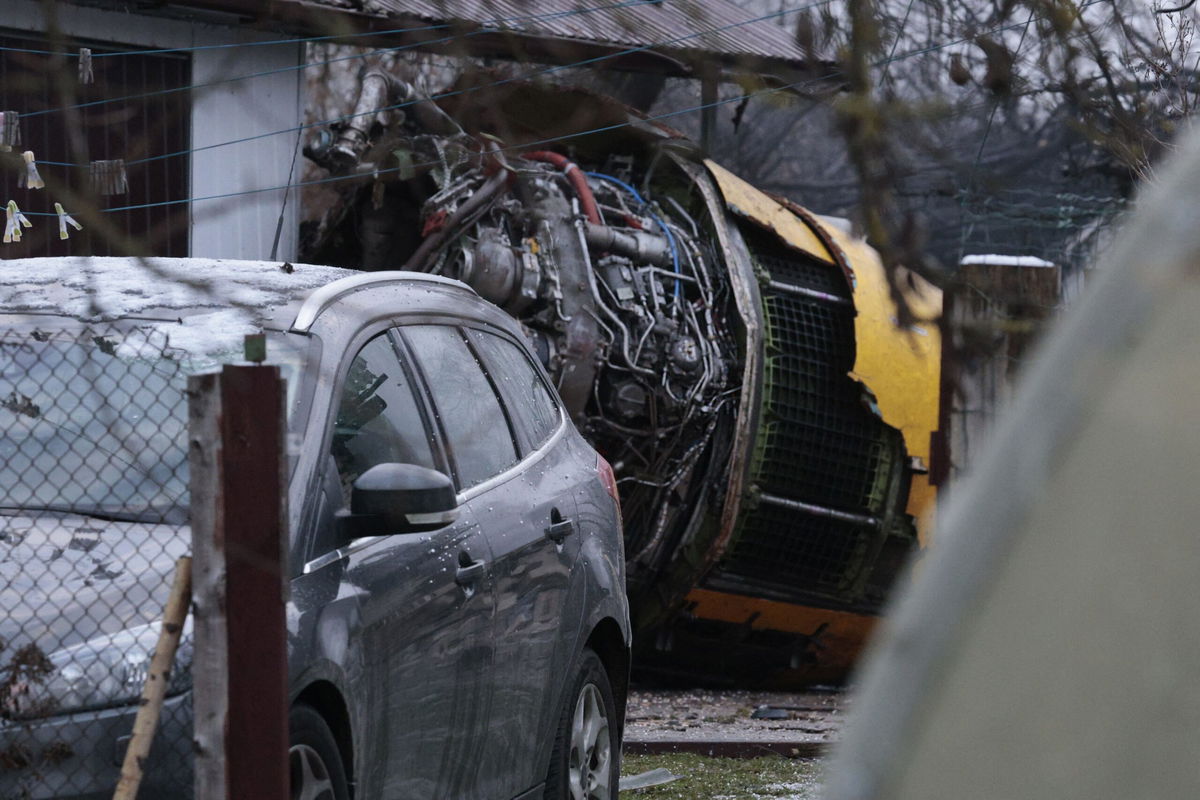 <i>Petras Malukas/AFP/Getty Images via CNN Newsource</i><br/>This photograph taken on November 25 shows the wreckage of a cargo plane in the courtyard of a house following its crash near the Vilnius International Airport in Vilnius.