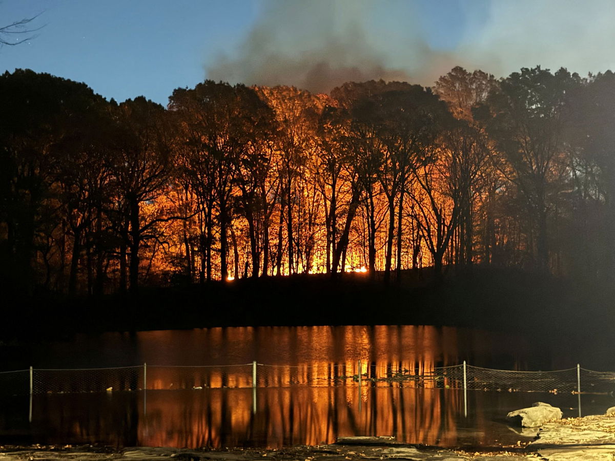 <i>Andrew Meher via CNN Newsource</i><br />Plumes of smoke drift off from the Jennings Creek Wildfire along the New York-New Jersey border on Sunday.