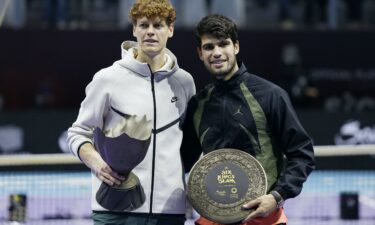 Alcaraz and Sinner shake hands after the former's victory in the French Open semifinals.