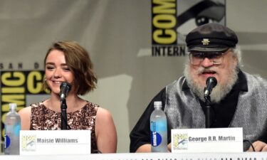 Actress Maisie Williams and writer George R.R. Martin attend HBO's "Game Of Thrones" panel and Q&A during Comic-Con International 2014 in San Diego.