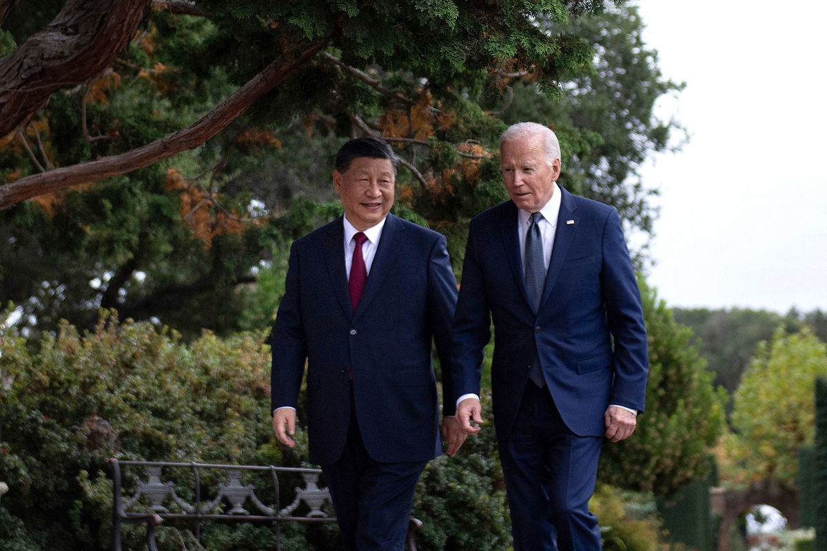 <i>Brendan Smialowski/AFP/Getty Images/File via CNN Newsource</i><br />President Joe Biden and Chinese President Xi Jinping walk together after a meeting during the Asia-Pacific Economic Cooperation (APEC) Leaders' week in Woodside