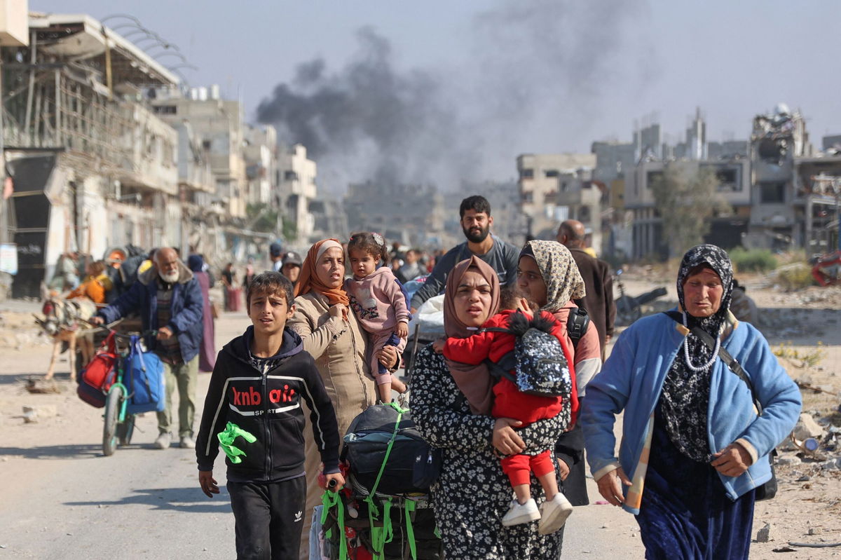 <i>Ali Moustafa/Getty Images via CNN Newsource</i><br/>Trucks with aid destined for the Gaza Strip are parked on the side of the road in Arish