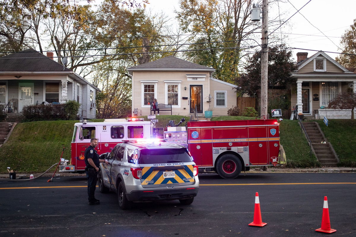 <i>Leandro Lozada/AFP/Getty Images via CNN Newsource</i><br/>A fire truck and police car on a street in the Clifton neighborhood of Louisville