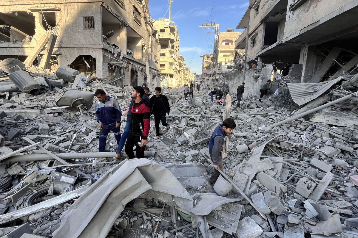 <i>Ali Jadallah/Anadolu/Getty Images via CNN Newsource</i><br/>Palestinians mourn near their relatives' funerals after Israeli airstrike hit Bureij Camp in Deir al-Balah