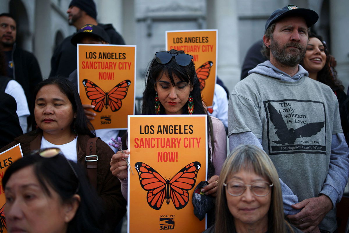 <i>Daniel Cole/Reuters via CNN Newsource</i><br/>Demonstrators attend a pro-immigration rally as the Los Angeles City Council meets to consider adopting a 