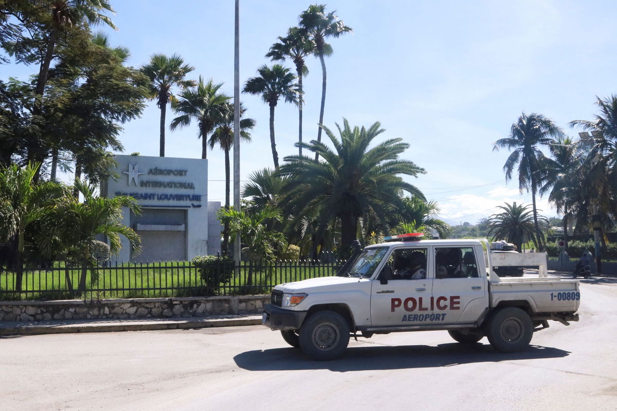 <i>Marckinson Pierre/Reuters via CNN Newsource</i><br/>A police vehicle drives outside Toussaint Louverture International Airport.