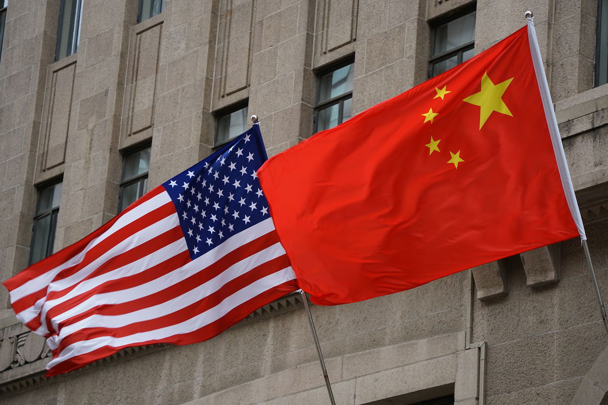 <i>VCG/Getty Images via CNN Newsource</i><br/>The national flags of the United States and China flutter at the Fairmont Peace Hotel on April 25