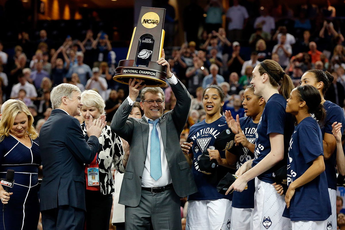 <i>Jessica Hill/AP via CNN Newsource</i><br/>UConn head coach Geno Auriemma and associate head coach Chris Dailey honored before the game on November 20.