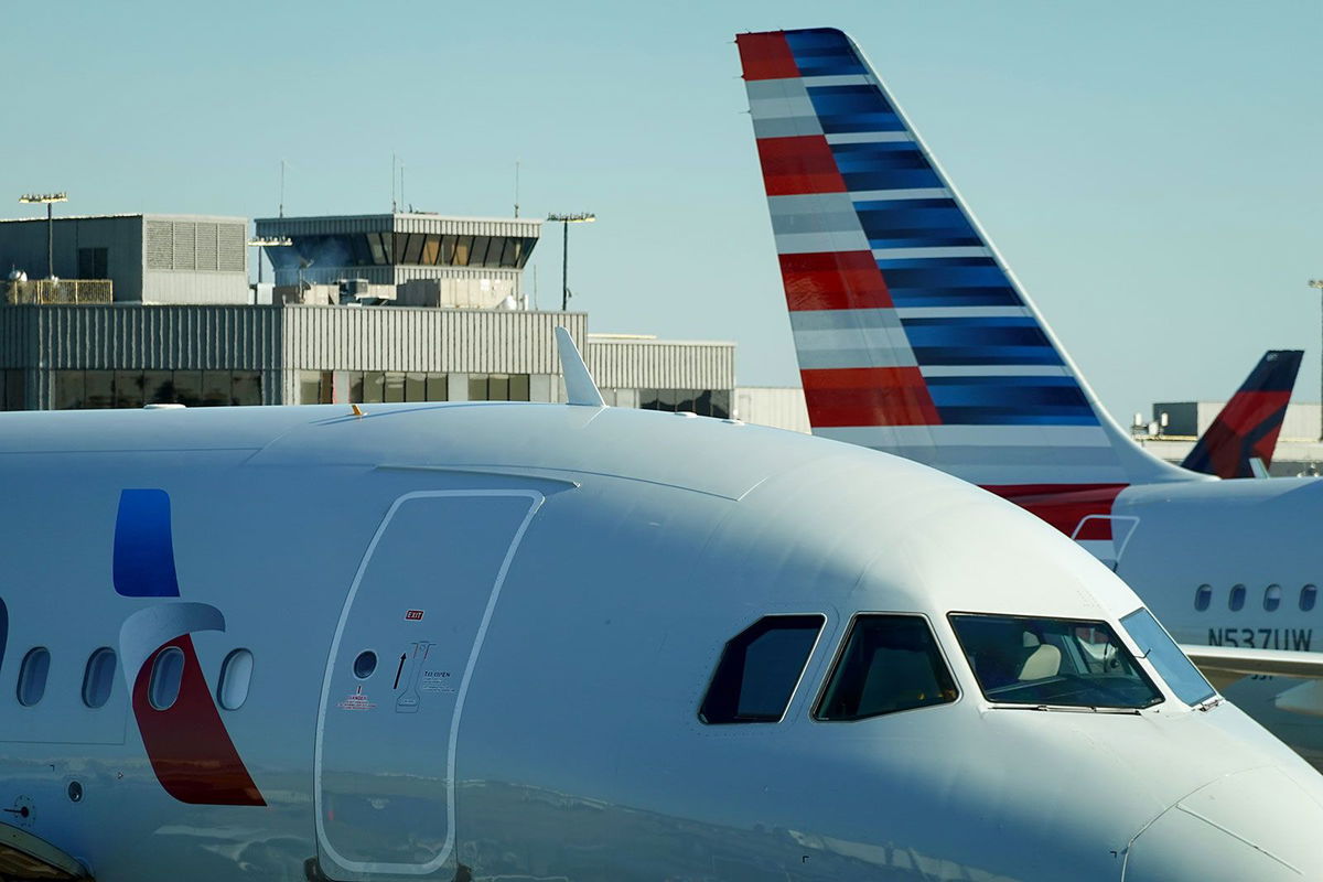 <i>Joe Raedle/Getty Images/File via CNN Newsource</i><br/>An American Airlines plane sits by a gate in October in Atlanta.