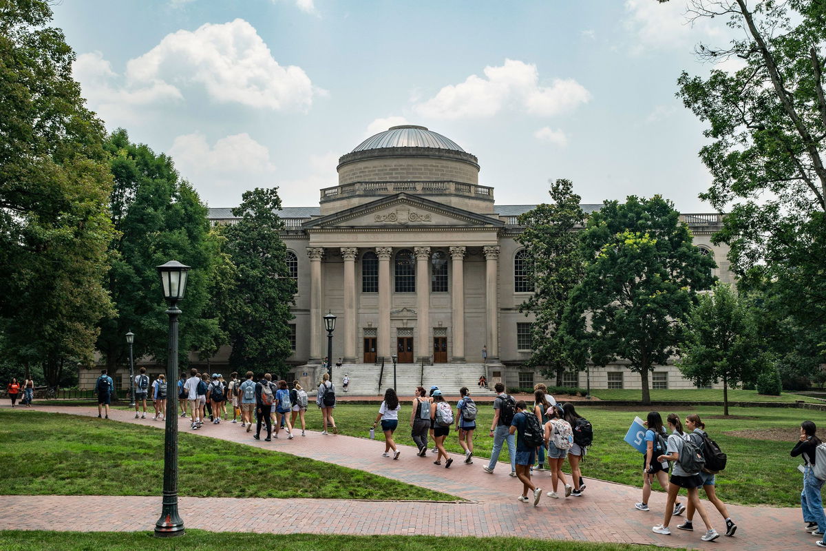 <i>Eros Hoagland/Getty Images via CNN Newsource</i><br/>People walk on the campus of the University of North Carolina Chapel Hill on June 29