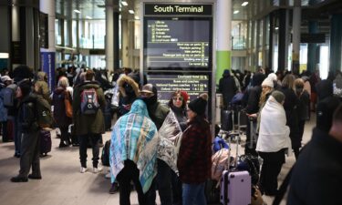 Passengers outside the terminal 4 at Gatwick Airport as a security cordon is in place around the South Terminal.