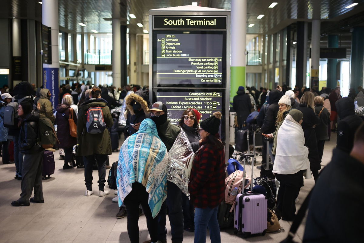 <i>Marcin Nowak/LNP/Shutterstock via CNN Newsource</i><br/>Passengers outside the terminal 4 at Gatwick Airport as a security cordon is in place around the South Terminal.