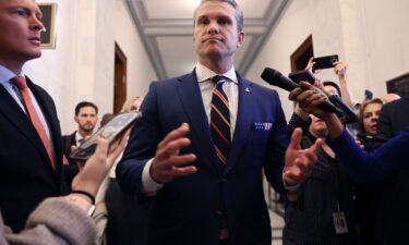 Pete Hegseth pauses to talk to reporters after a series of meetings with senators in the Russell Senate Office Building on Capitol Hill on November 21