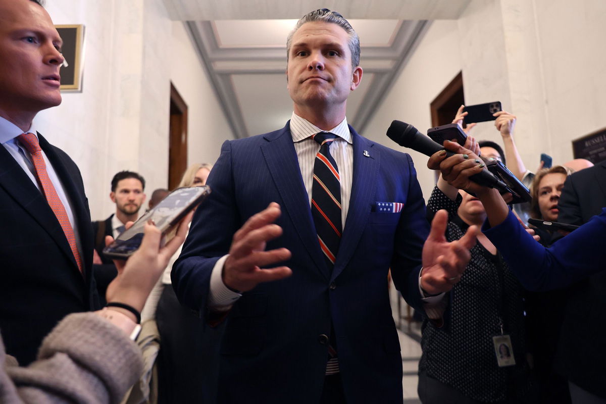 <i>Chip Somodevilla/Getty Images via CNN Newsource</i><br/>Pete Hegseth pauses to talk to reporters after a series of meetings with senators in the Russell Senate Office Building on Capitol Hill on November 21