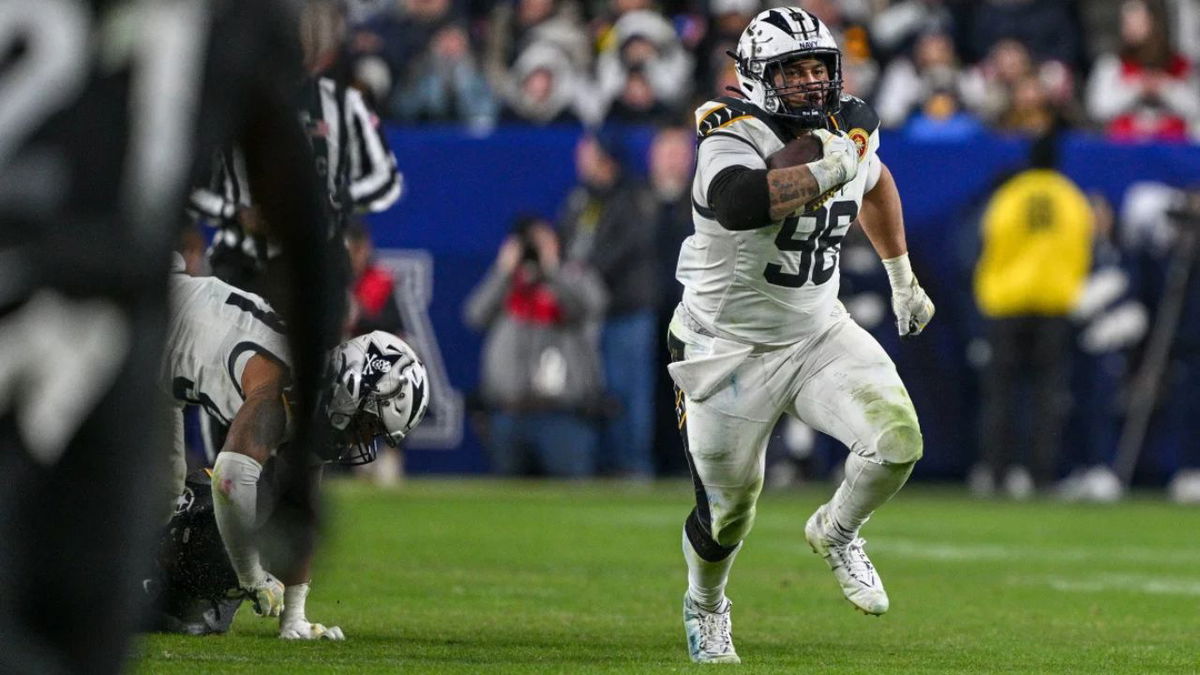 Navy Midshipmen defensive tackle Landon Robinson (No. 96) runs on a fake punt during the second half against the Army Black Knights. Tommy Gilligan/Imagn Images