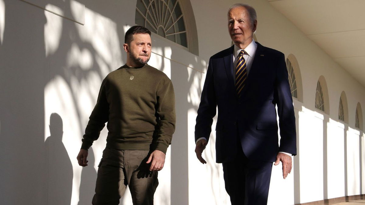 President Joe Biden, right, and Ukraine President Volodymyr Zelensky walk down the Colonnade as they make their way to the Oval Office at the White House on December 21, 2022 in Washington, DC.
