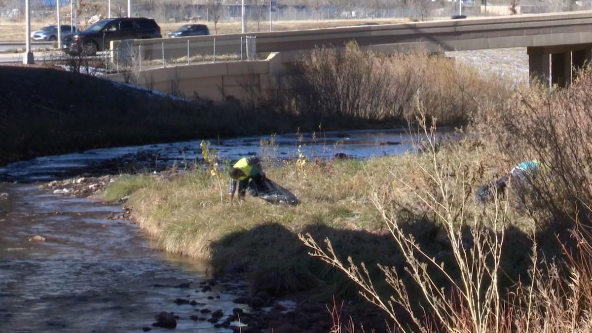 ASEZ WAO volunteer cleaning up America the Beautiful Park.