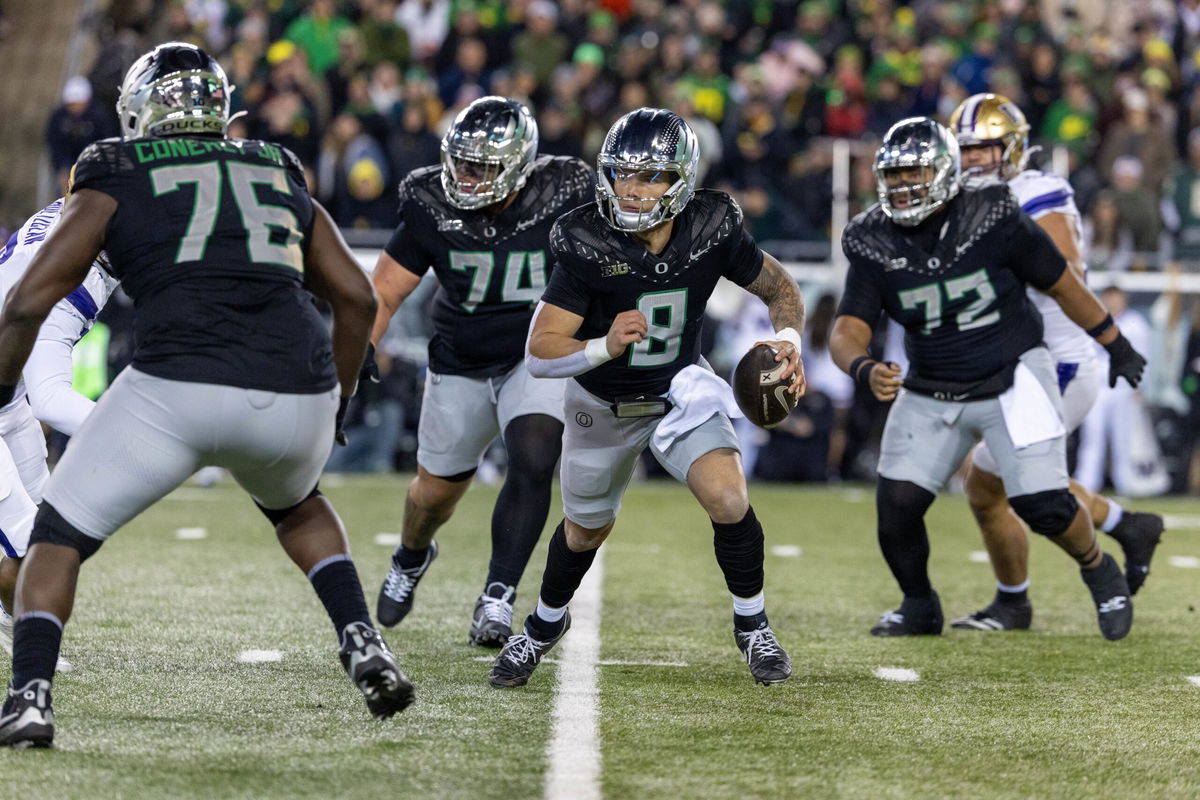 <i>Tom Hauck/Getty Images via CNN Newsource</i><br/>Oregon Ducks quarterback Dillon Gabriel runs against the Washington Huskies.