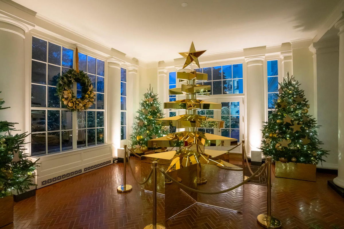 <i>The White House via CNN Newsource</i><br/>The first Christmas tree display featured on the White House tour is dedicated to Gold Star Families. This year’s Gold Star Tree exhibit is constructed of six oversized and stacked stars