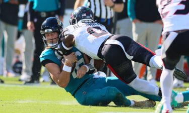 Houston Texans linebacker Azeez Al-Shaair (No. 0) was escorted off the field after being ejected from Sunday's game against the Jacksonville Jaguars