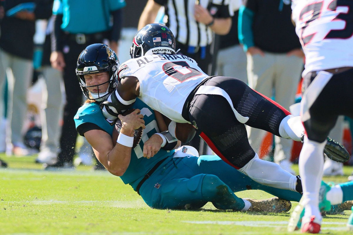 <i>David Rosenblum/Icon Sportswire/Getty Images via CNN Newsource</i><br/>Houston Texans linebacker Azeez Al-Shaair (No. 0) was escorted off the field after being ejected from Sunday's game against the Jacksonville Jaguars