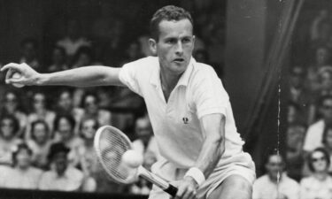 Neale Fraser is pictured in action at the 1957 Wimbledon Championships.