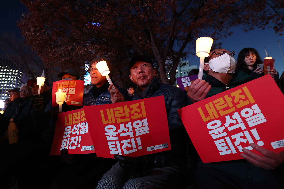 <i>Philip Fong/AFP/Getty Images via CNN Newsource</i><br/>Protesters taking part in a march against South Korea President Yoon Suk Yeol head toward the Presidential Office in Seoul on Wednesday