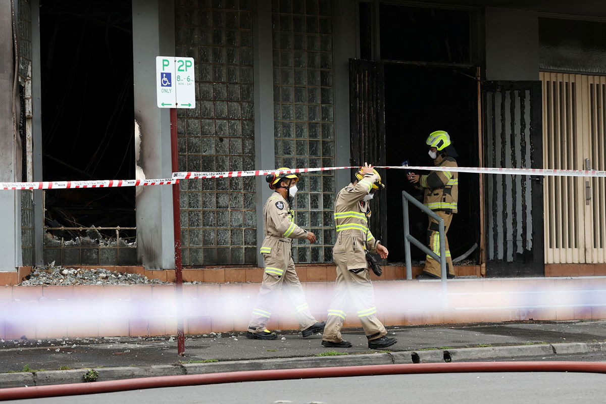 <i>AAP Image/Con Chronis via Reuters via CNN Newsource</i><br/>A policewoman stands guard at the scene of a fire at the Adass Israel Synagogue in Ripponlea