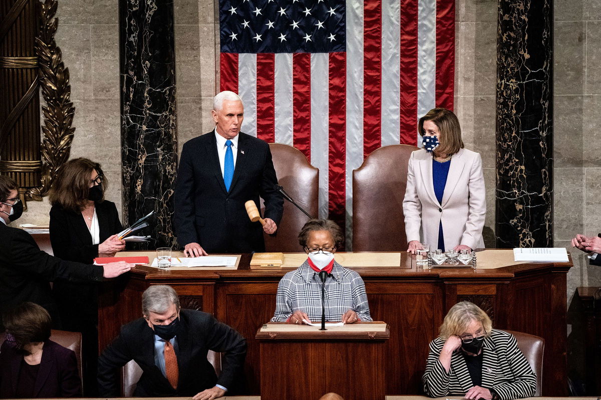 <i>Erin Schaff/The New York Times/Pool/Getty Images/File via CNN Newsource</i><br/>Vice President Mike Pence and Speaker of the House Nancy Pelosi preside over a joint session of Congress in January 2021 in Washington