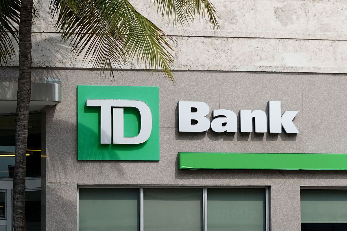 <i>Joe Raedle/Getty Images/File via CNN Newsource</i><br/>A sign hangs outside of a TD Bank on April 5