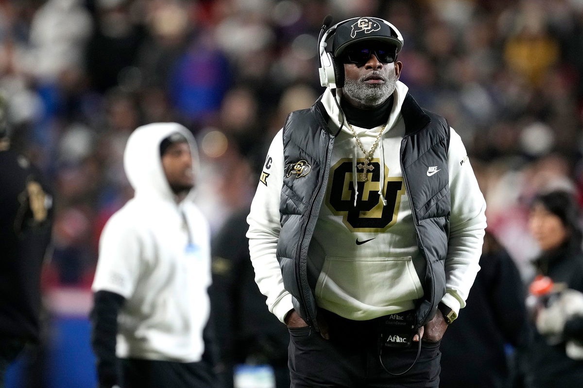 <i>David Zalubowski/AP/File via CNN Newsource</i><br/>Colorado head coach Deion Sanders speaks with Travis Hunter during a game in November.