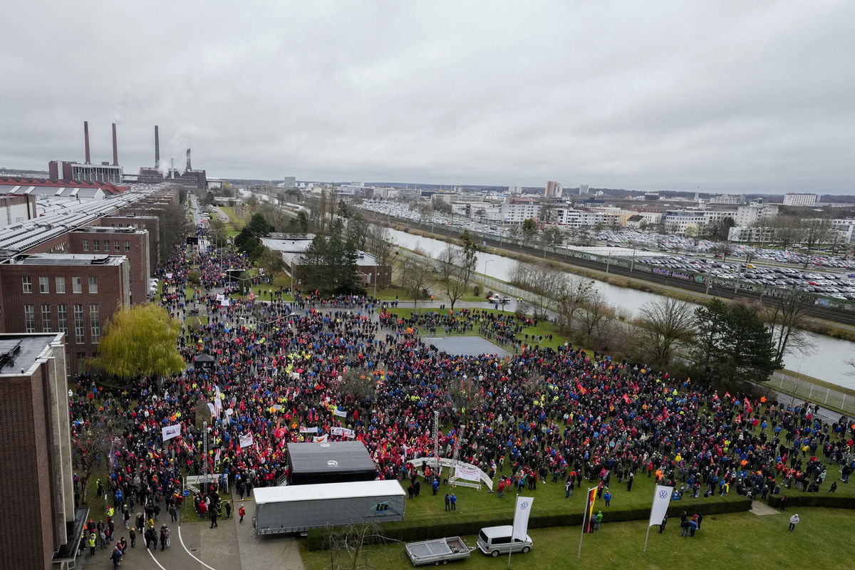 <i>Martin Meissner/Pool/AFP/Getty Images via CNN Newsource</i><br/>Employees attend a metalworkers' union rally in front of automaker Volkswagen's headquarters during a warning strike at its main factory in Wolfsburg