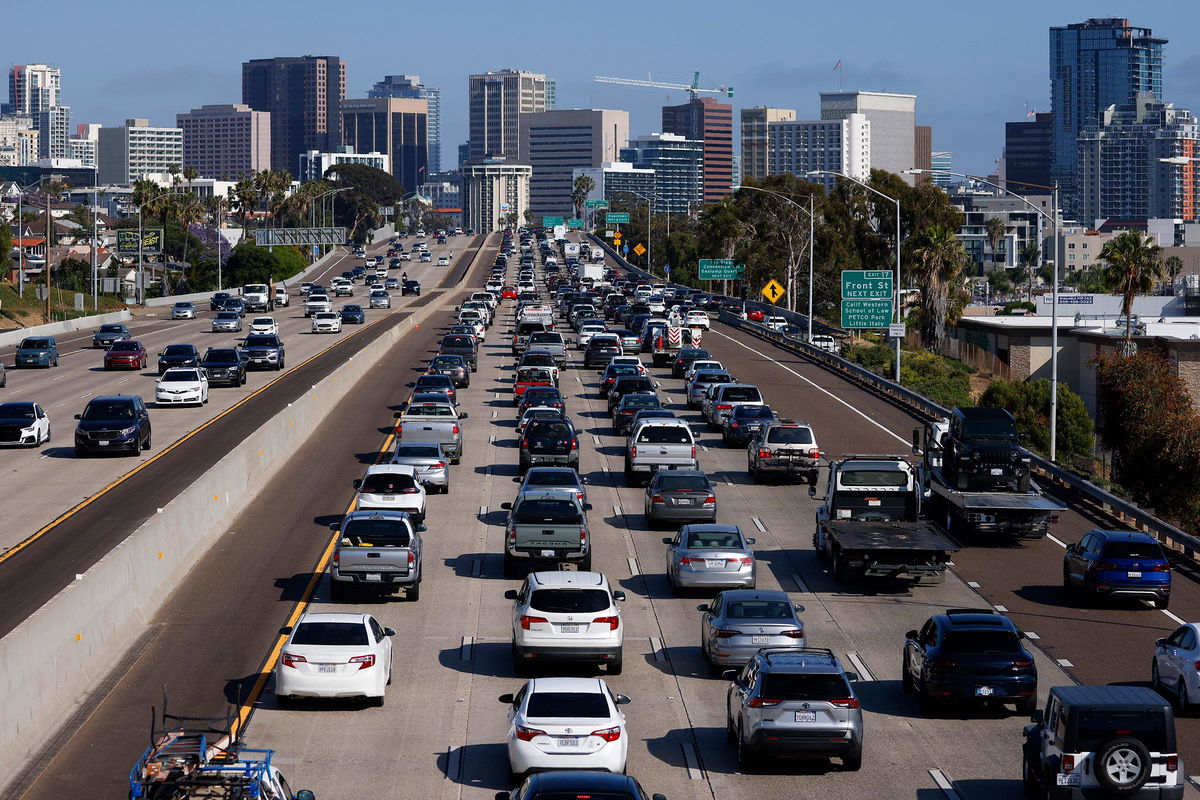 <i>Kevin Carter/Getty Images via CNN Newsource</i><br/>Drivers sit in traffic on southbound Interstate 5 during the afternoon commute heading into downtown San Diego on May 29.