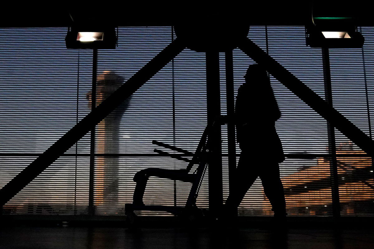 <i>Nam Y. Huh/AP via CNN Newsource</i><br/>An airline employee transfers a wheelchair at O'Hare International Airport in Chicago in November 2022.