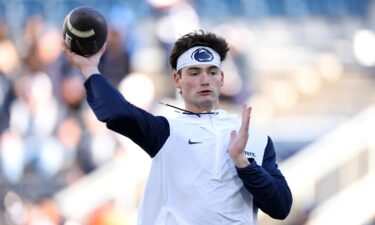 Beau Pribula warms up ahead of a game against Ohio State in November 2.