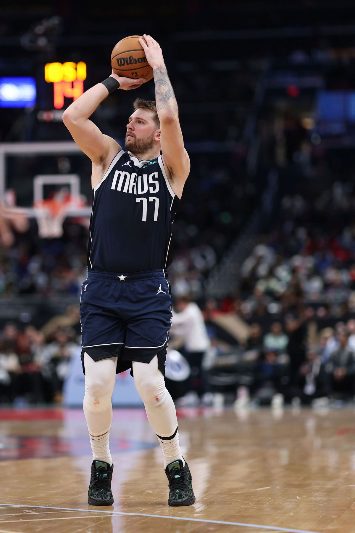 <i>Patrick Smith/Getty Images via CNN Newsource</i><br/>Luka Doncic #77 of the Dallas Mavericks shoots the ball against the Washington Wizards during the second half at Capital One Arena on December 5